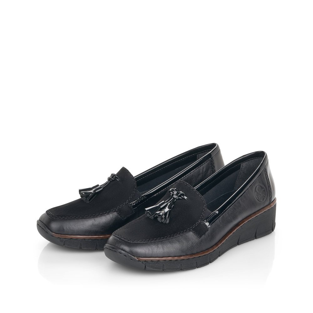 Black Rieker women´s loafers 53771-00 with an elastic insert as well as slim fit E. Shoes laterally.