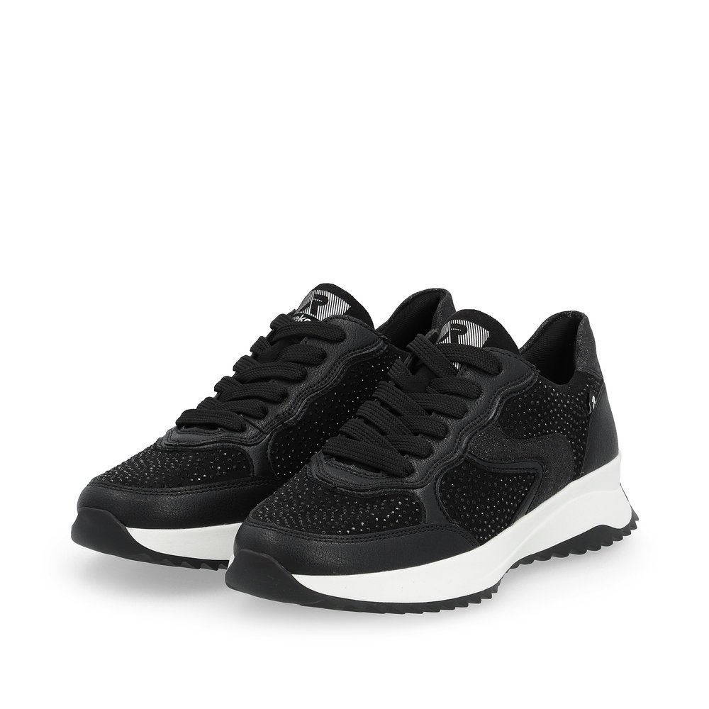 Black Rieker women´s low-top sneakers W1304-00 with an abrasion-resistant sole. Shoes laterally.