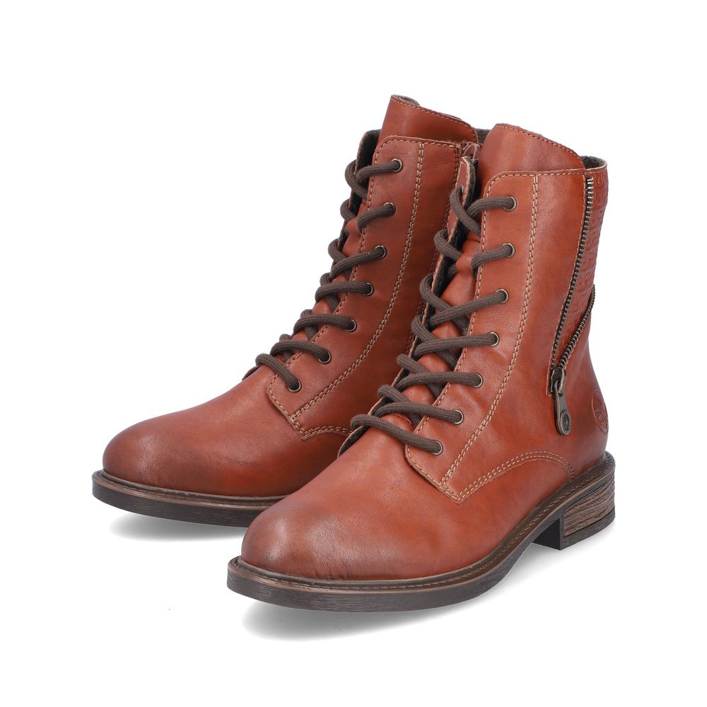 Bottes à lacets Rieker marron pour femme 71450-24 avec fermeture éclair. Chaussures inclinées sur le côté.