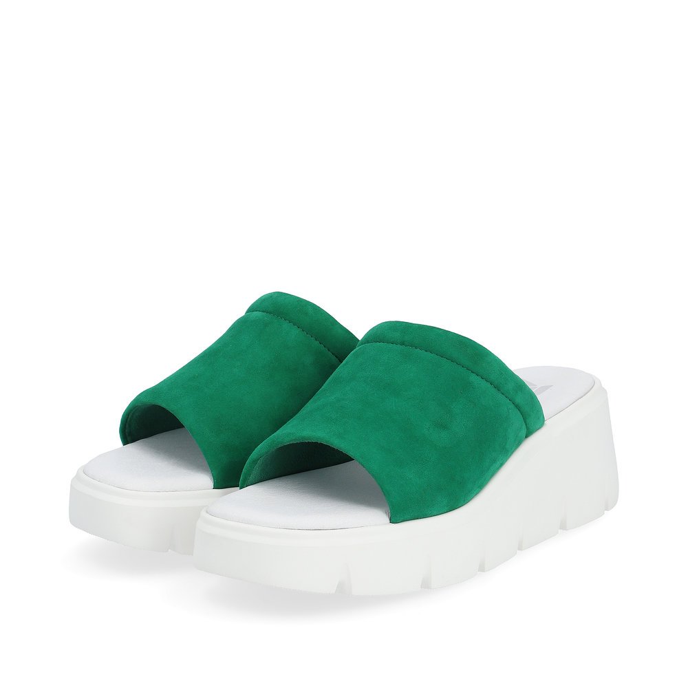 Green Rieker women´s mules W1551-52 with an ultra light sole with wedge heel. Shoes laterally.