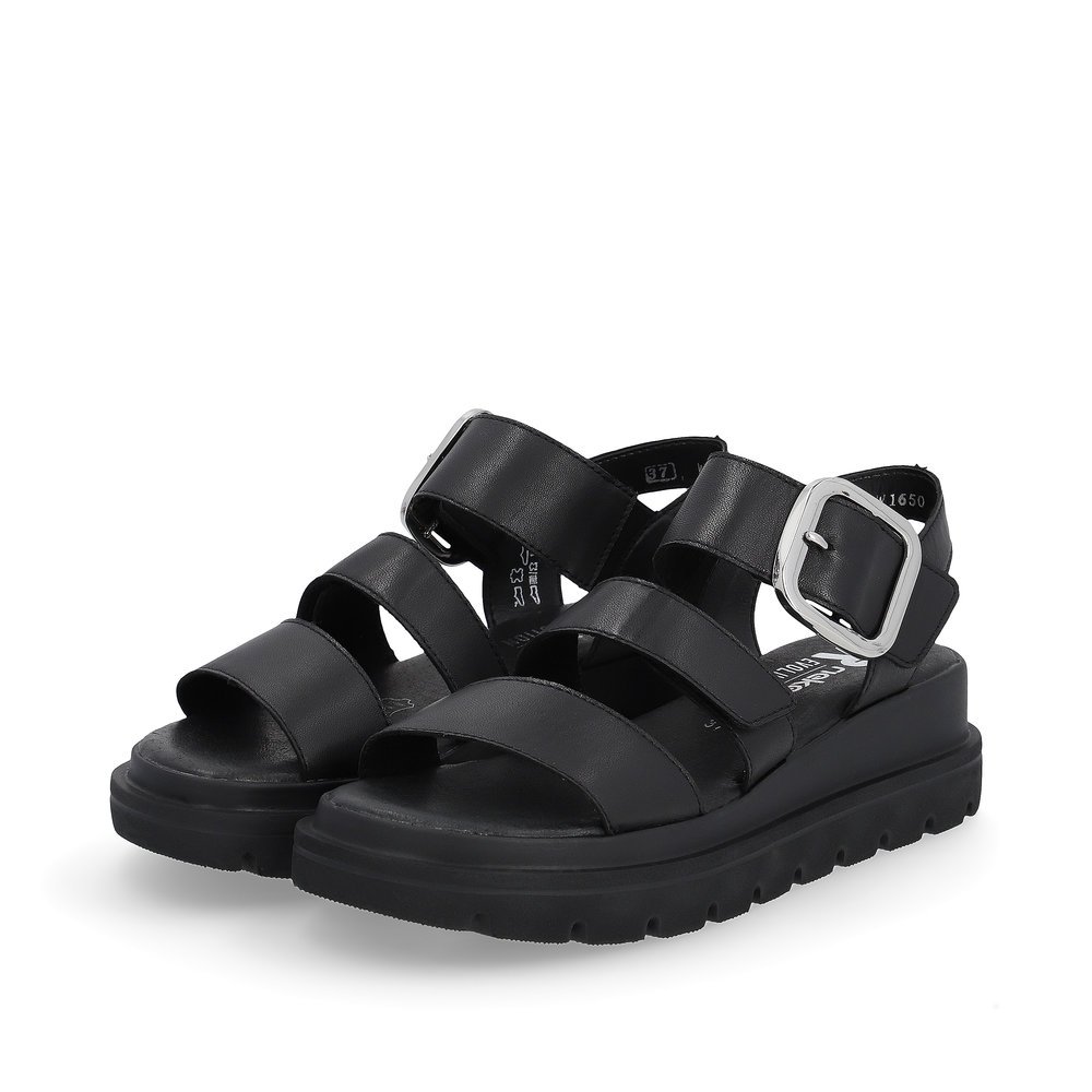 Black Rieker women´s wedge sandals W1650-00 with a flexible sole with wedge heel. Shoes laterally.