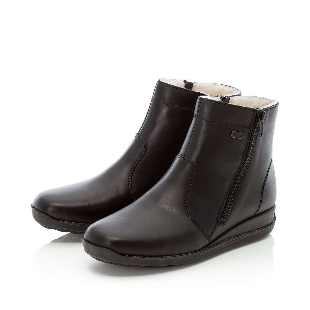 Black Rieker women´s ankle boots 98252-01 with RiekerTEX membrane as well as zipper. Shoes laterally.