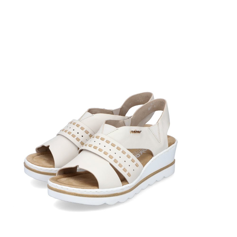 Beige Rieker women´s wedge sandals 67489-60 with an elastic insert. Shoes laterally.