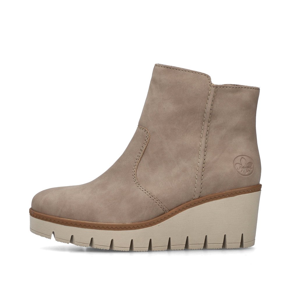 Beige Rieker women´s ankle boots Y5065-64 with zipper as well as a removable insole. Outside of the shoe.