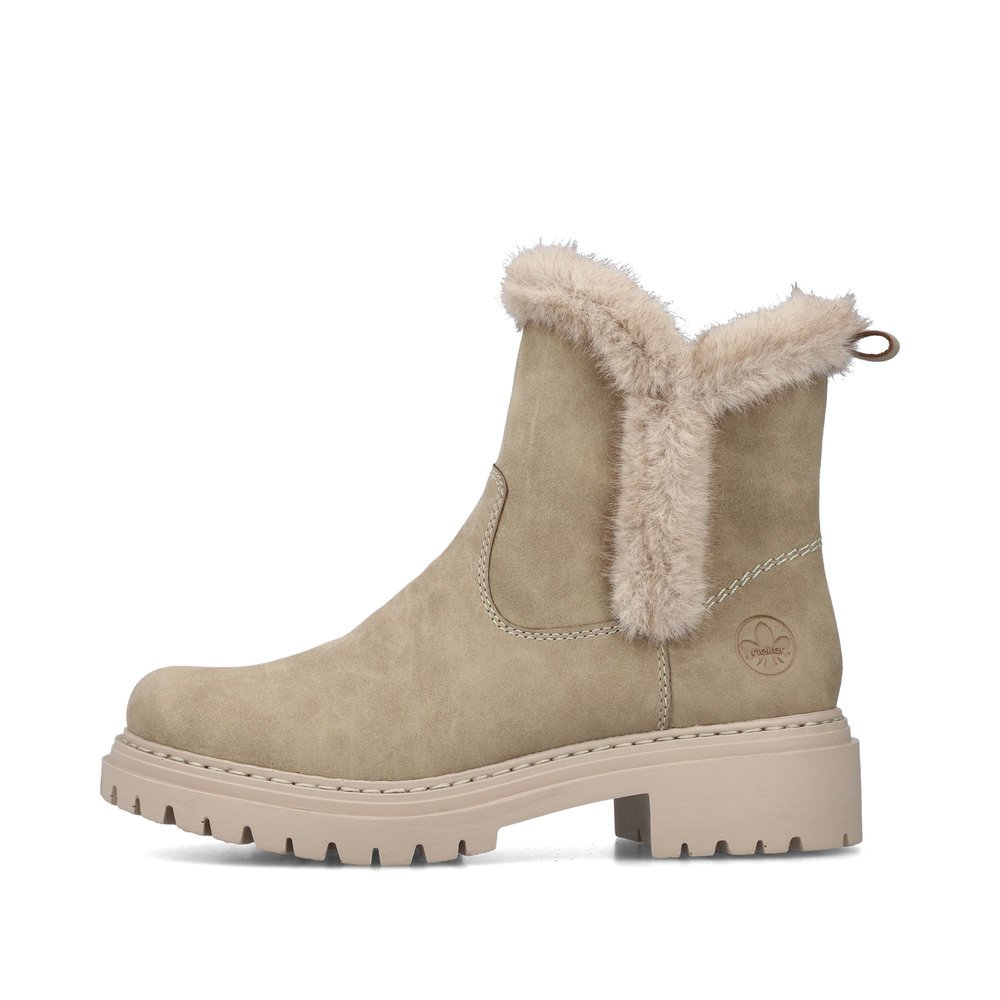 Sand beige Rieker women´s ankle boots 72682-60 with a fur design as well as zipper. Outside of the shoe.