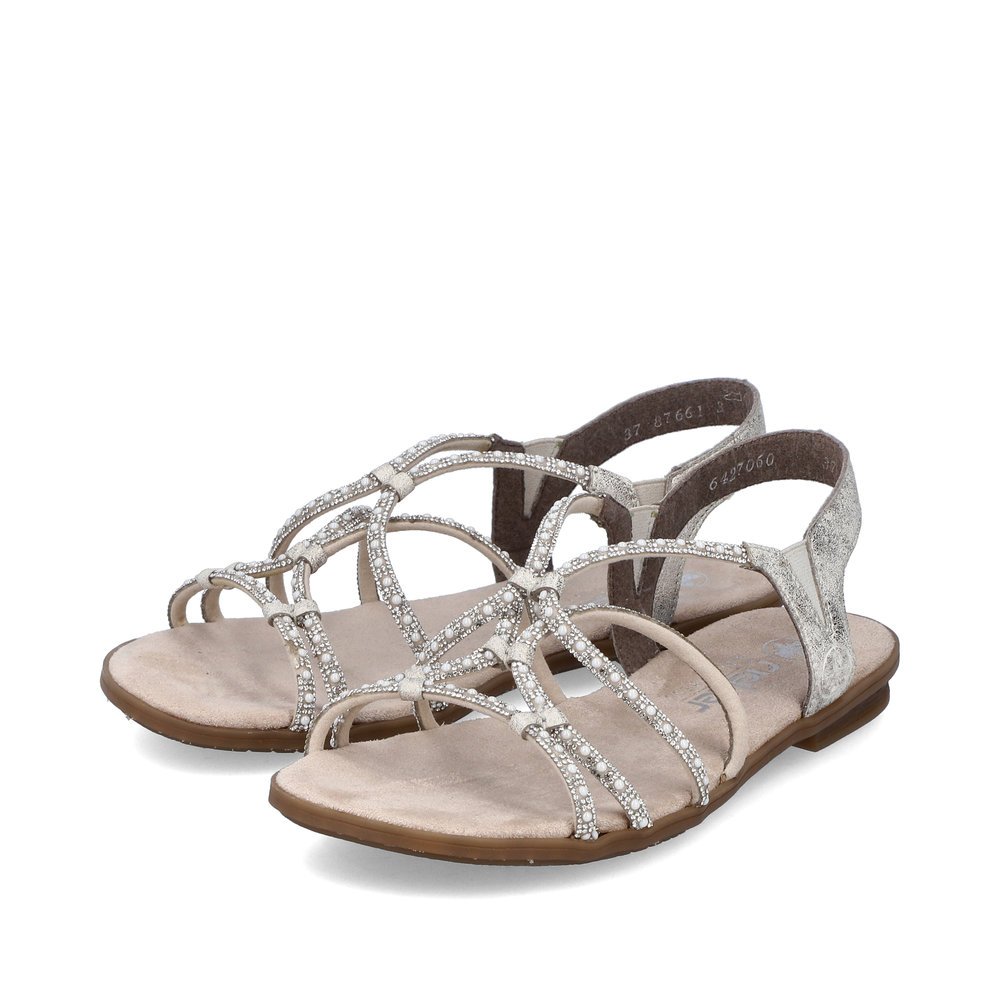 Beige Rieker women´s strap sandals 64270-60 with an elastic insert. Shoes laterally.