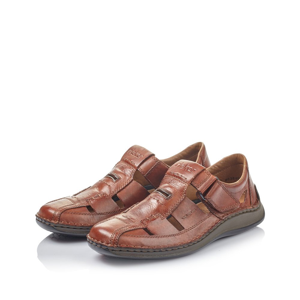 Brown Rieker men´s slippers 05284-24 with a hook and loop fastener. Shoes laterally.