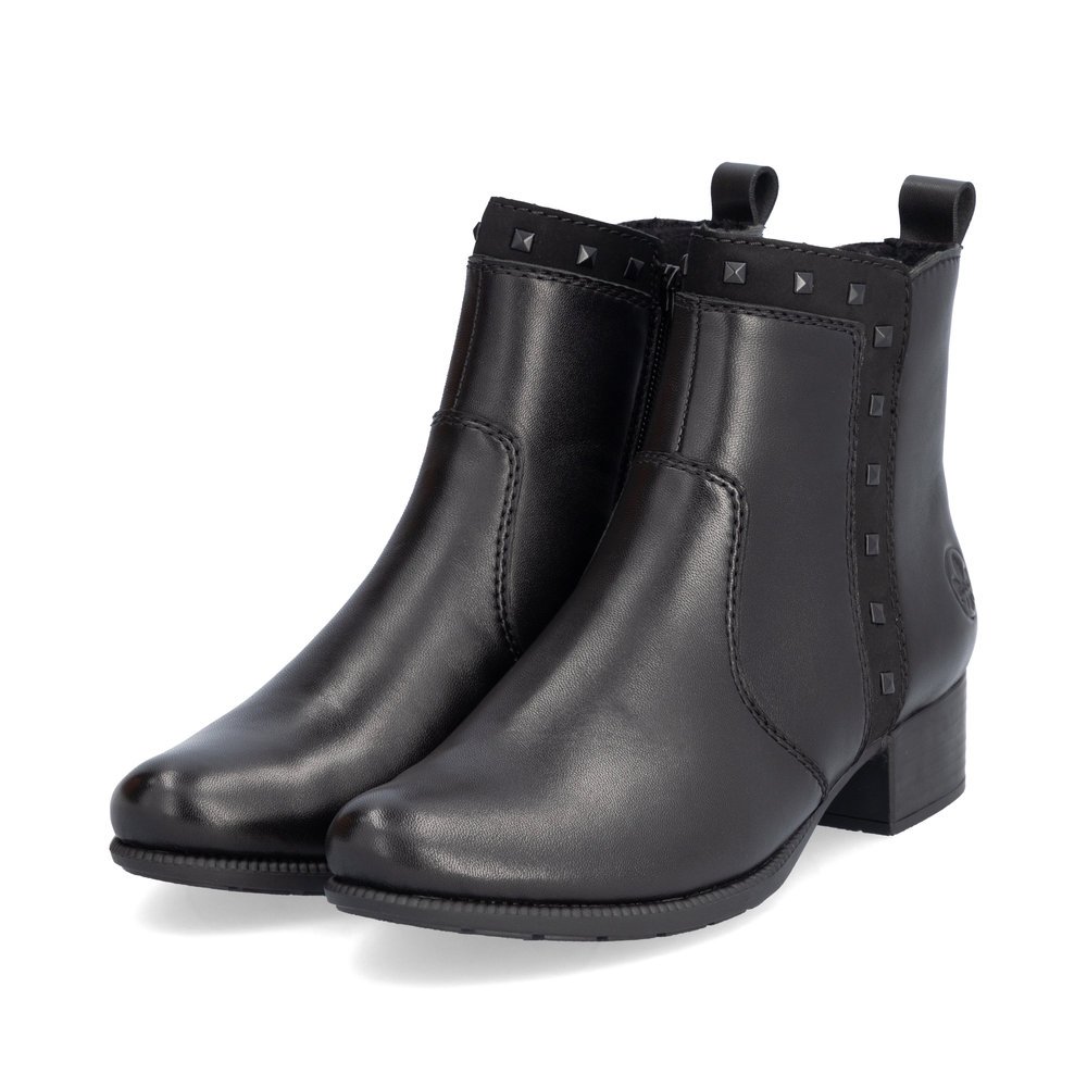 Matt black Rieker women´s ankle boots 78657-00 with a decorative rivets. Shoes laterally.