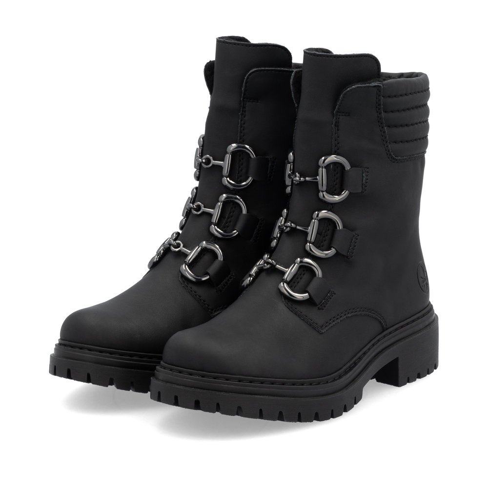 Jet black Rieker women´s biker boots 72650-01 with a decorative elements. Shoes laterally.