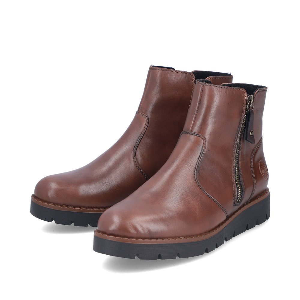 Bottines Rieker marron pour femme 44950-24 avec fermeture éclair. Chaussures inclinées sur le côté.