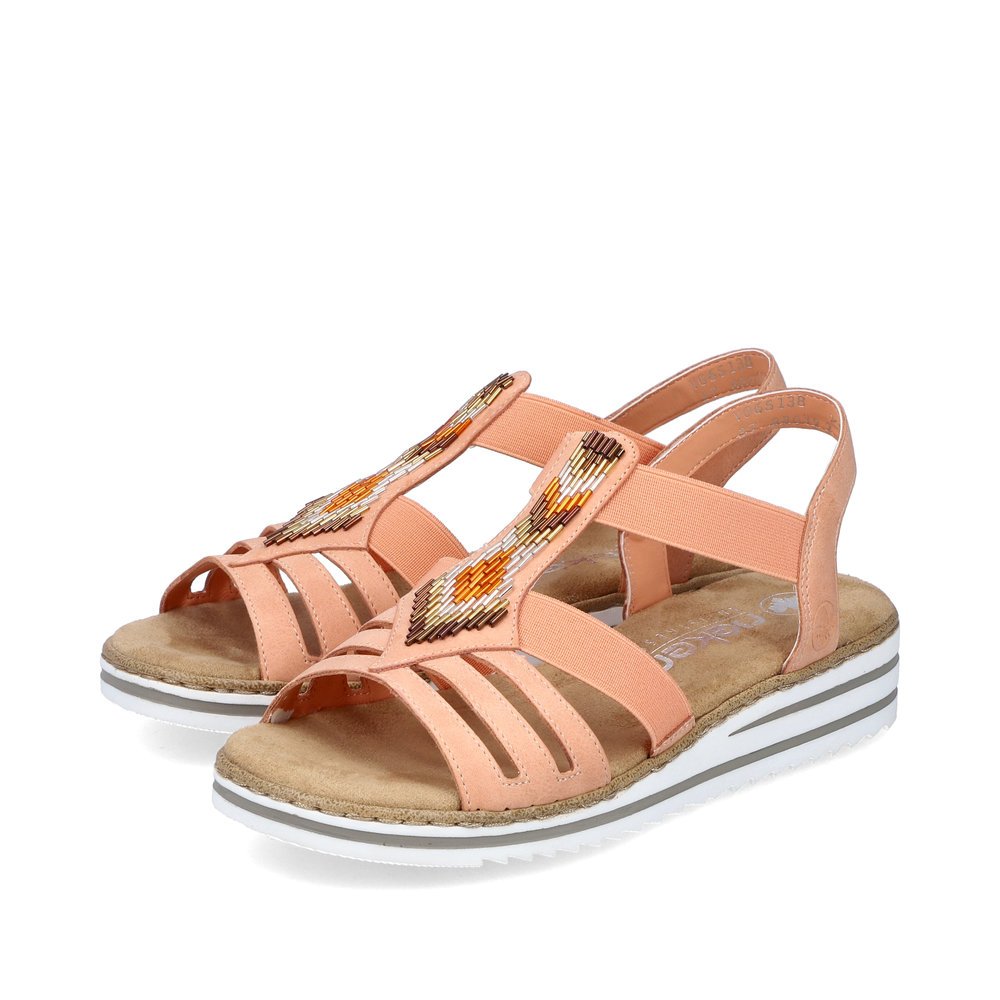 Peach Rieker women´s wedge sandals V0651-38 with an elastic insert. Shoes laterally.