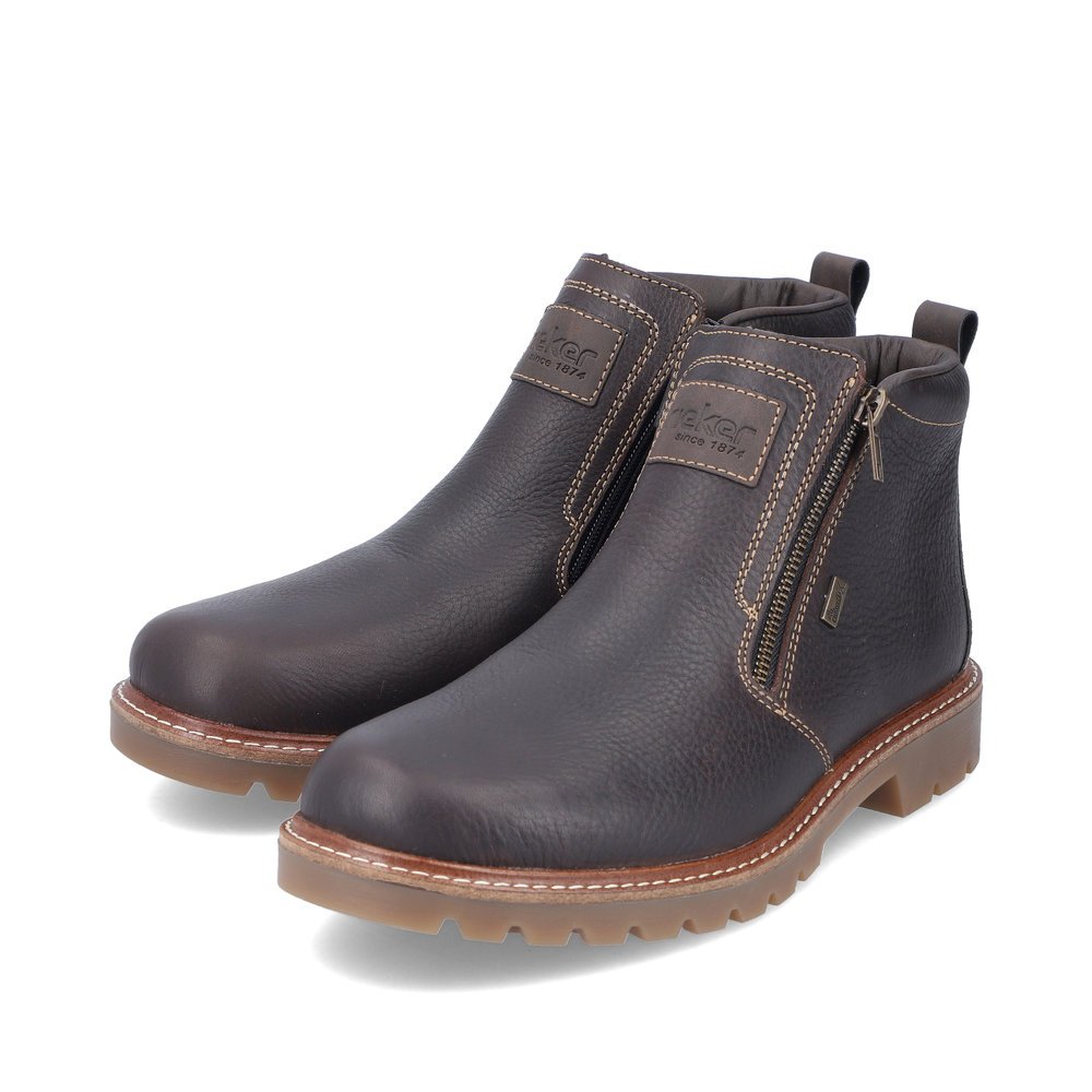 Bottines Rieker marron homme 39871-25 avec semelle adhérente Fiber-Grip. Chaussures inclinées sur le côté.