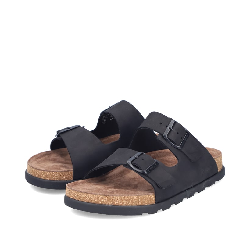 Mules Rieker noires pour homme 21190-00 avec boucles. Chaussures inclinées sur le côté.