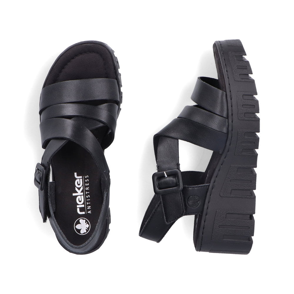 Schwarze Rieker Keilsandaletten 68063-00 mit trendiger Schnalle. Schuh von oben, liegend.