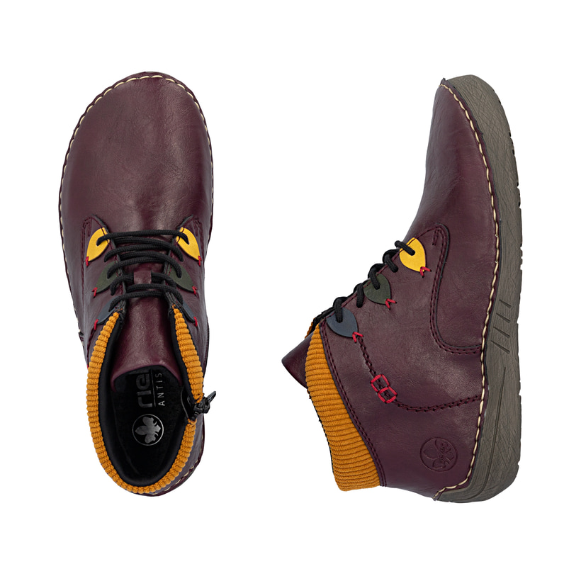 Bottines Rieker rouges pour femmes 52544-30 avec détails colorés. Chaussure vue de dessus, couchée.