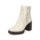 
Vanillebeige Rieker Damen Stiefeletten Y4155-60 mit Reißverschluss sowie Blockabsatz. Schuh seitlich schräg
