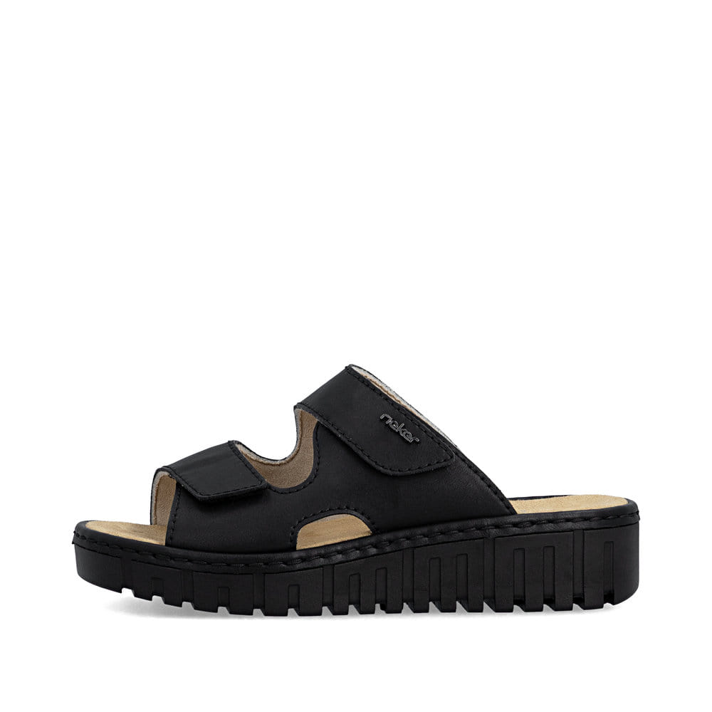 Schwarze Rieker Damen Pantoletten V1392-00 mit einem Klettverschluss. Schuh Außenseite.