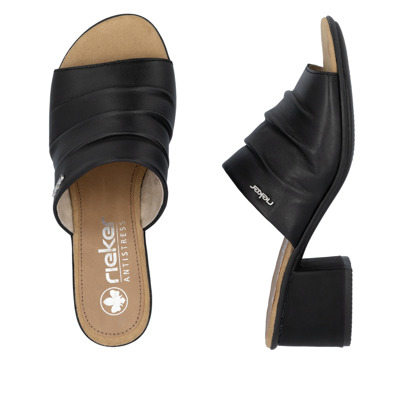 Schwarze Rieker Damen Pantoletten 64687-00 mit einer schockabsorbierenden Sohle. Schuh von oben, liegend.