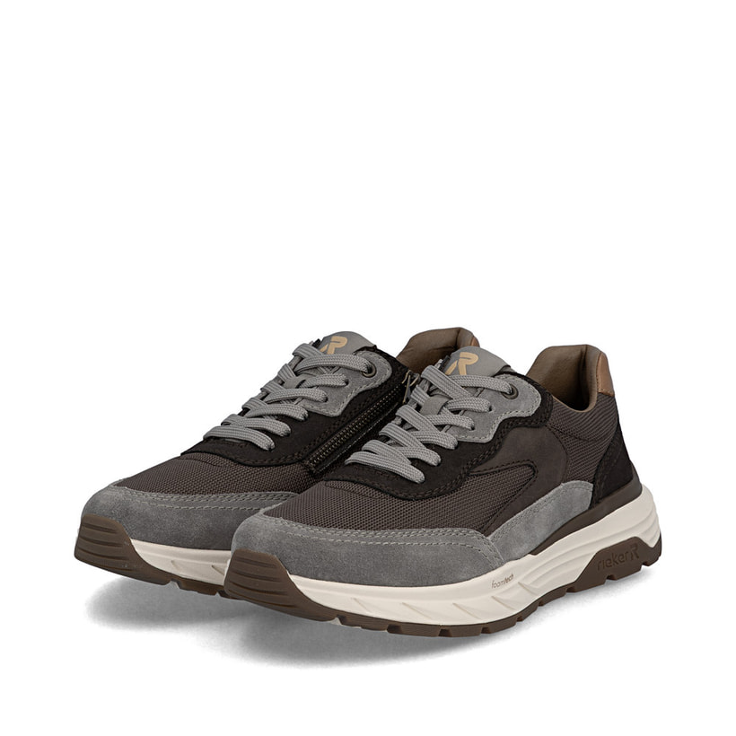Baskets basses Rieker marron pour homme 06100-25 avec fermeture éclair. Chaussures inclinées sur le côté.