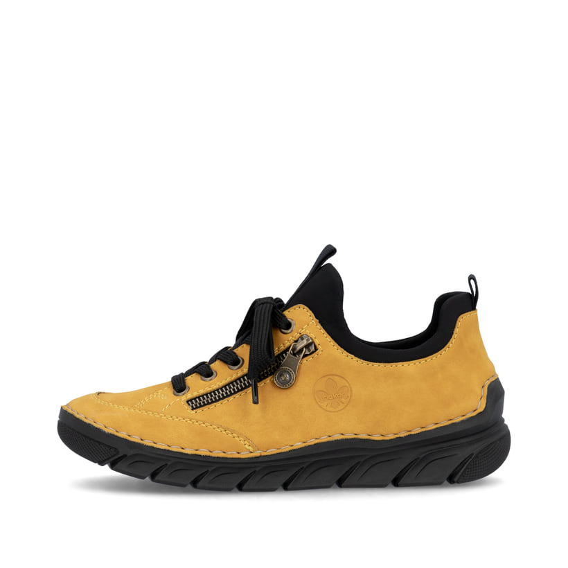 
Sonnengelbe Rieker Damen Slipper 55073-68 mit einer schockabsorbierenden Sohle. Schuh Außenseite