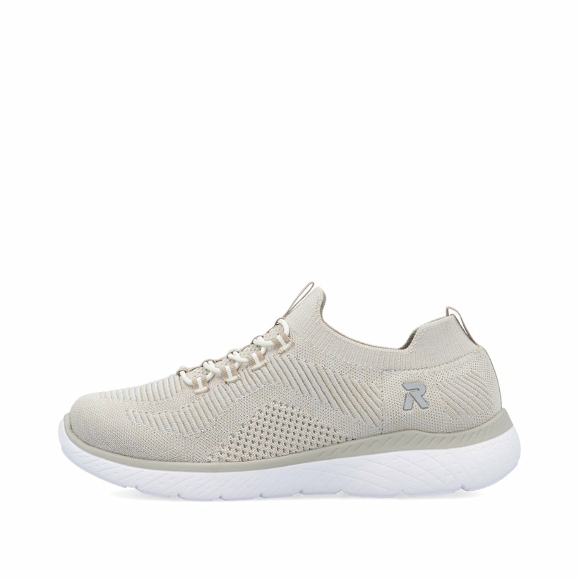 Beige vegane Rieker Damen Slipper M5074-64 mit Gummizug sowie flexibler Sohle. Schuh Außenseite.