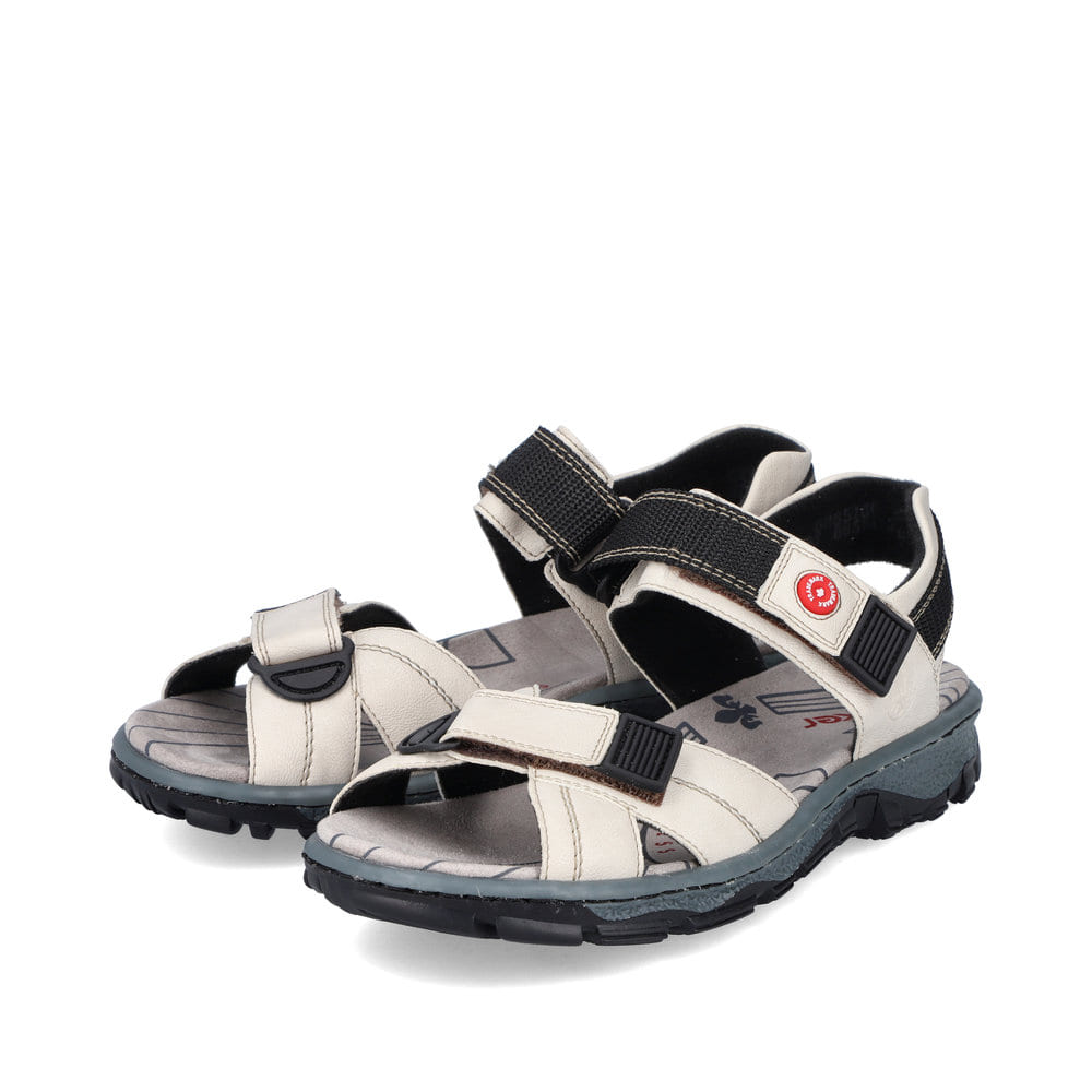 Weiße Rieker Damen Trekkingsandalen 68851-80 mit einem Klettverschluss. Schuhpaar seitlich schräg.
