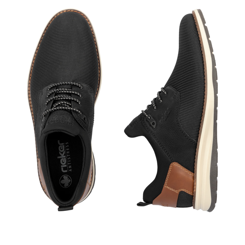 Schwarze Rieker Herren Slipper 14750-00 mit Gummizug sowie Komfortweite G 1/2. Schuh von oben, liegend.