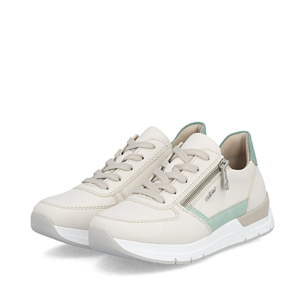 Baskets basses Rieker beiges pour femme 58902-60 avec fermeture éclair. Chaussures inclinées sur le côté.