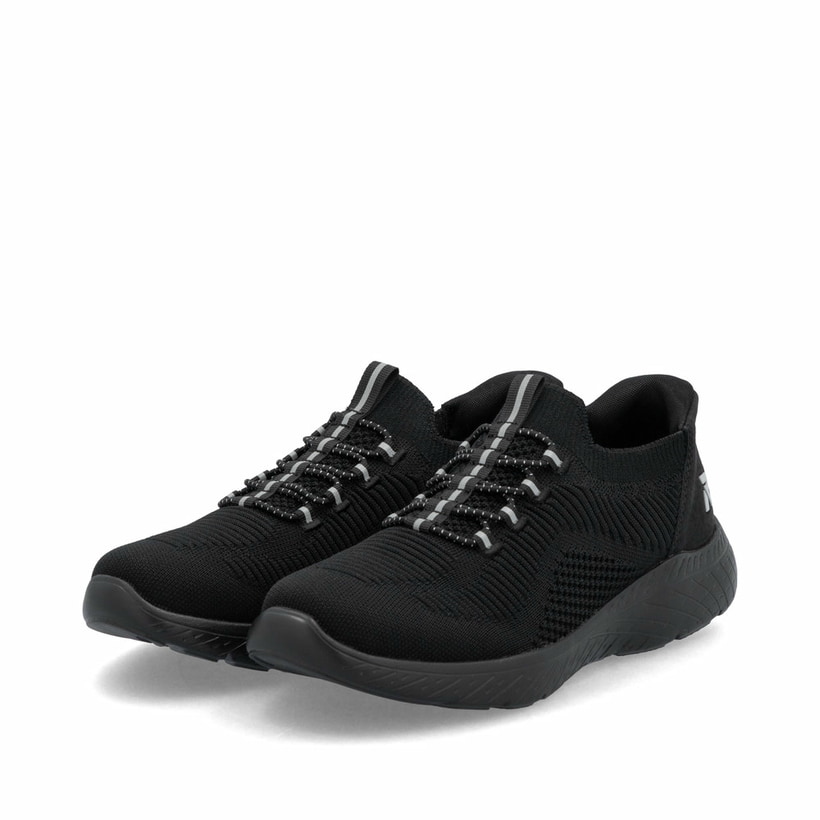 Baskets basses Rieker noires femme M5066-00 avec option easy in facile. Chaussures inclinées sur le côté.