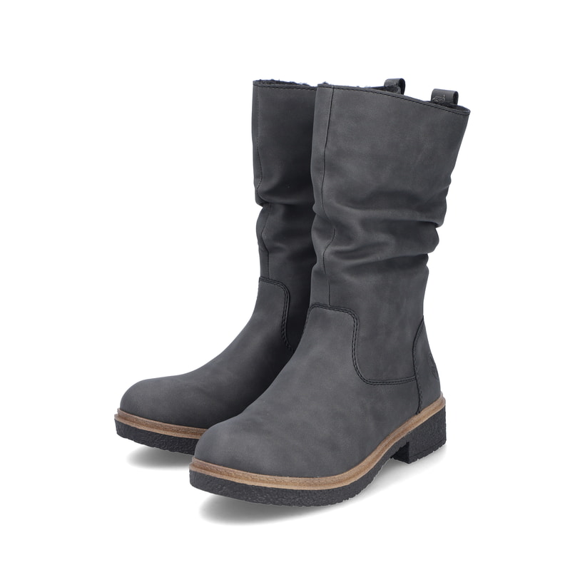 
Sandbeige Rieker Damen Chelsea Boots Z4994-60 mit einer schockabsorbierenden Sohle. Schuh seitlich schräg