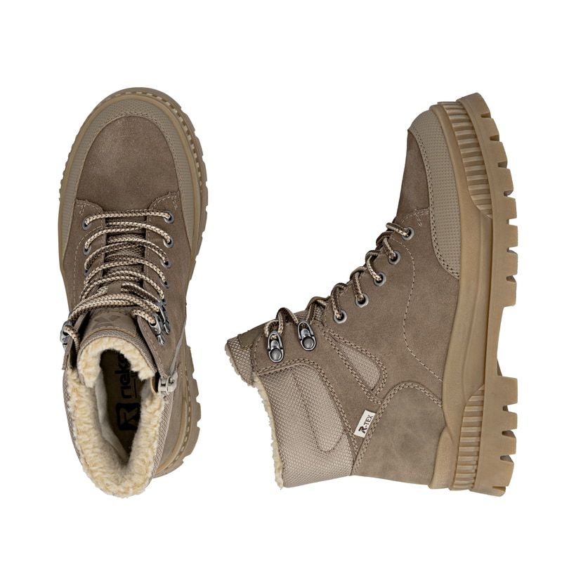 Bottes à lacets Rieker beiges pour femme W2176-64 avec semelle Fiber-Grip. Chaussure vue de dessus, couchée.