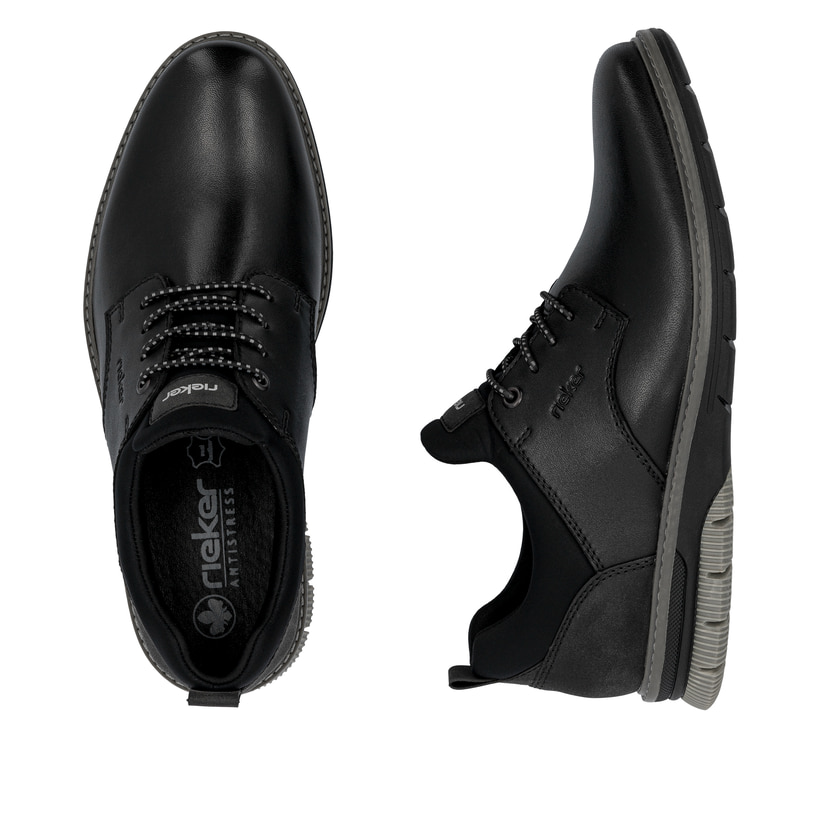 Schwarze Rieker Herren Slipper 14454-01 aus Glattleder mit einem Gummizug. Schuh von oben, liegend.