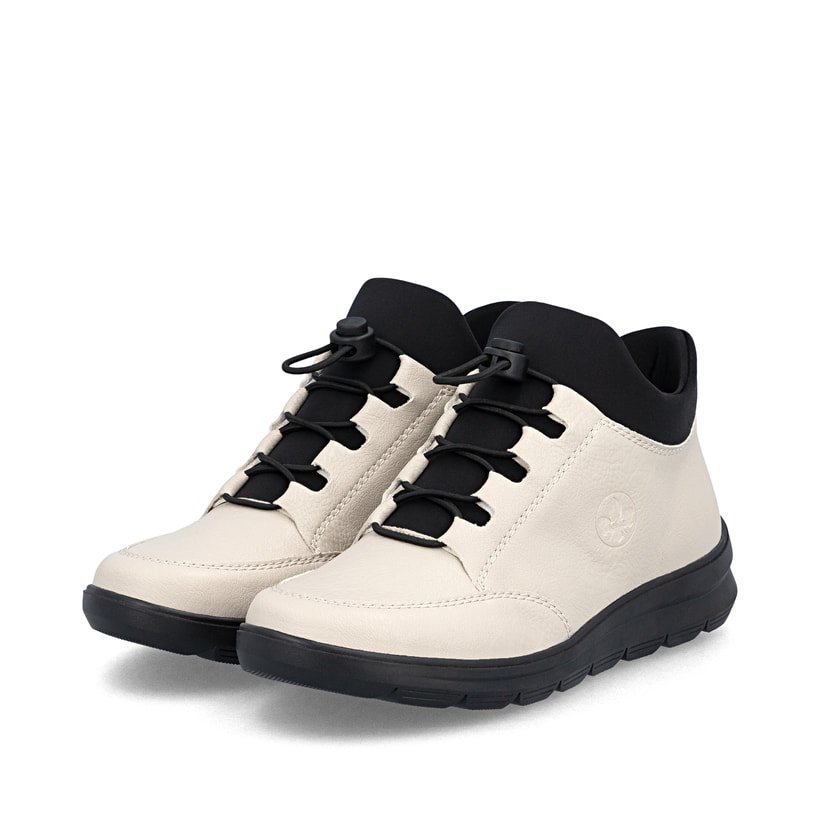 Bottines Rieker beiges pour femmes Z0065-60 avec fermeture éclair. Chaussures inclinées sur le côté.