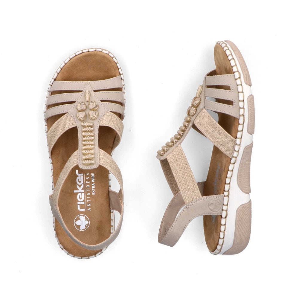 Beige Rieker Damen Riemchensandalen 66201-62 mit Schmuckelementen sowie Gummizug. Schuh von oben, liegend.