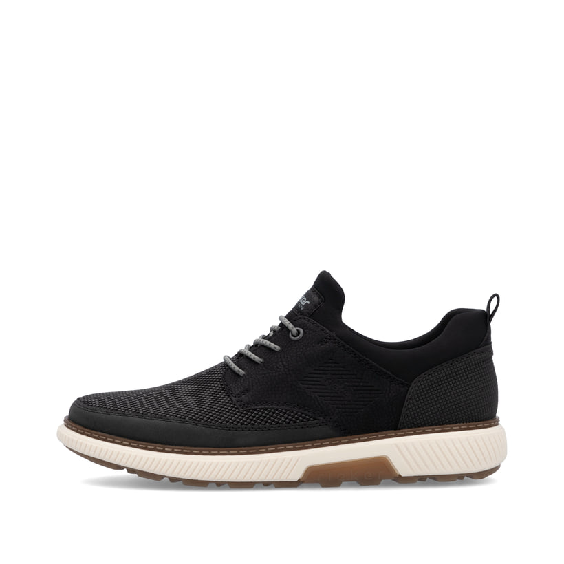 Schwarze Rieker Herren Slipper B3354-00 mit einem Gummizug sowie Extraweite H. Schuh Außenseite.