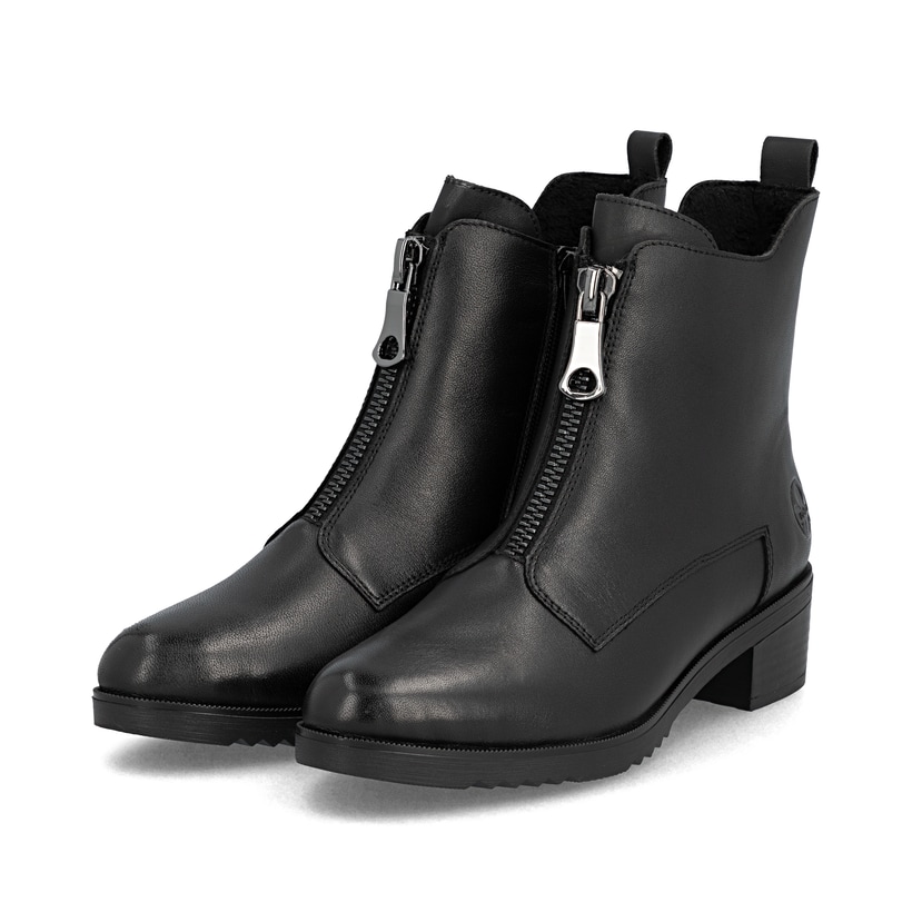 Bottines Rieker noires femme Y0552-00 en cuir lisse avec fermeture éclair. Chaussures inclinées sur le côté.