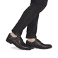 Dunkelbraune Rieker Herren Schnürschuhe 13523-25 aus Glattleder. Schuh am Fuß.