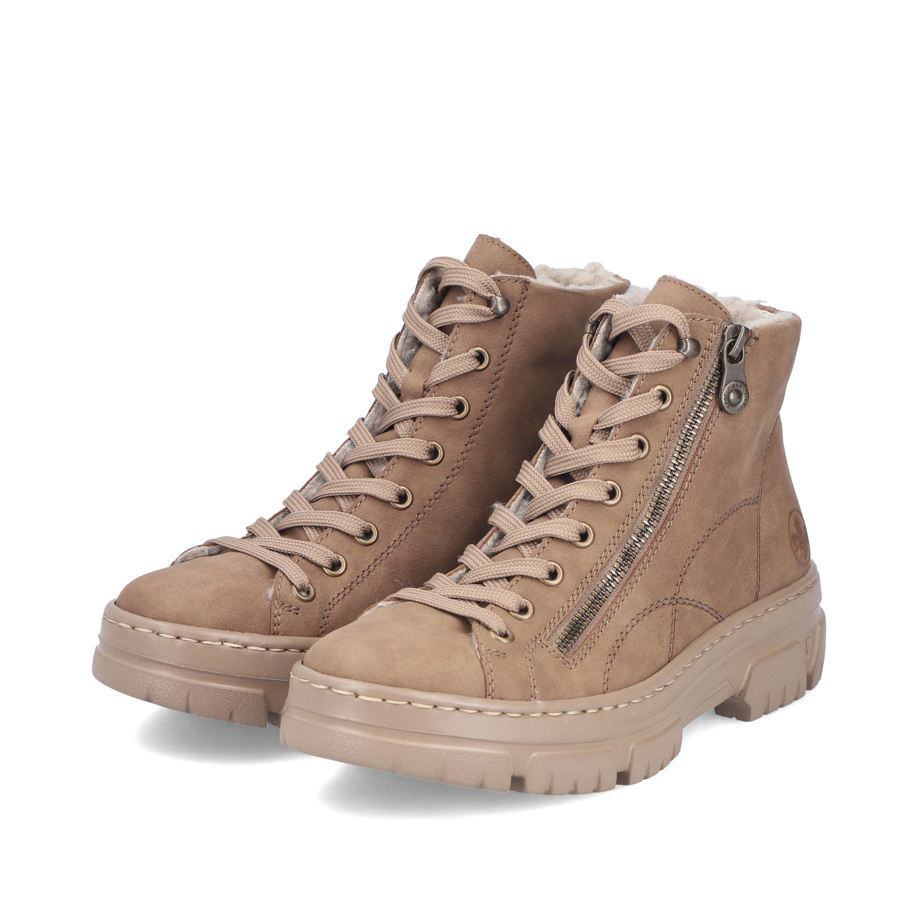 Beige Rieker Damen Schnürstiefel Z7410-20 mit modernen Ziernähten. Schuhpaar seitlich schräg.