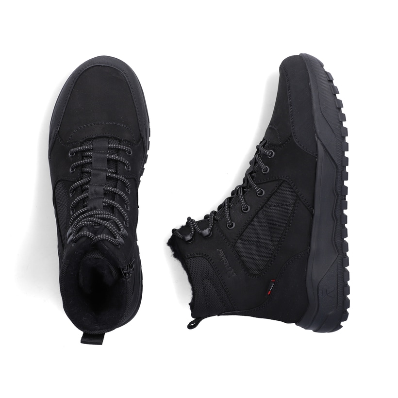 Schwarze Rieker Herren Schnürstiefel U1510-00 mit griffiger Fiber-Grip Sohle. Schuh von oben, liegend.