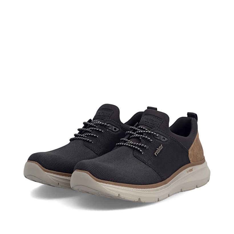 Mocassins Rieker noirs pour hommes B1850-00 avec la semelle lightsole+. Chaussures inclinées sur le côté.
