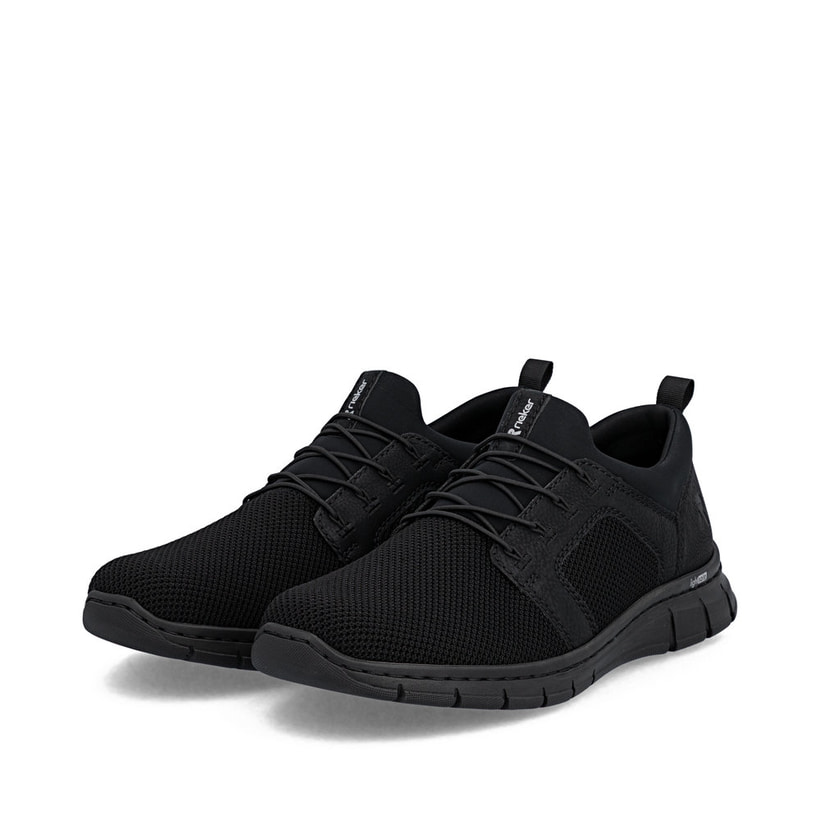 Mocassins Rieker noirs pour homme B7796-01 avec bande élastique. Chaussures inclinées sur le côté.