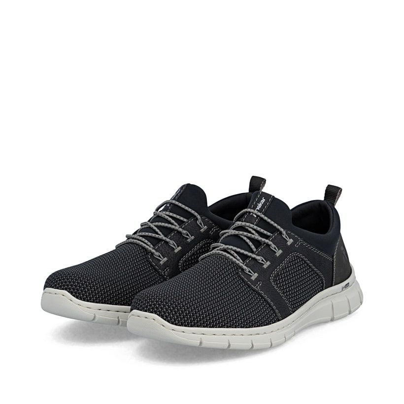 Mocassins Rieker noirs pour homme B7796-02 avec bande élastique. Chaussures inclinées sur le côté.