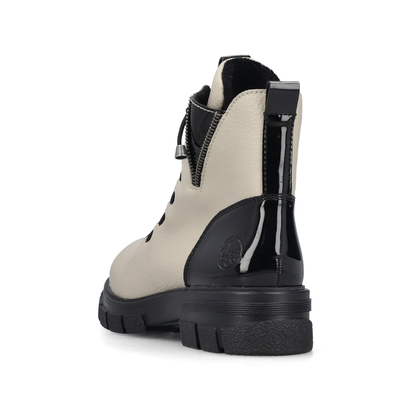 Beigeschwarze Rieker Damen Biker Boots Z9152-60 mit einem Reißverschluss. Schuh von hinten.