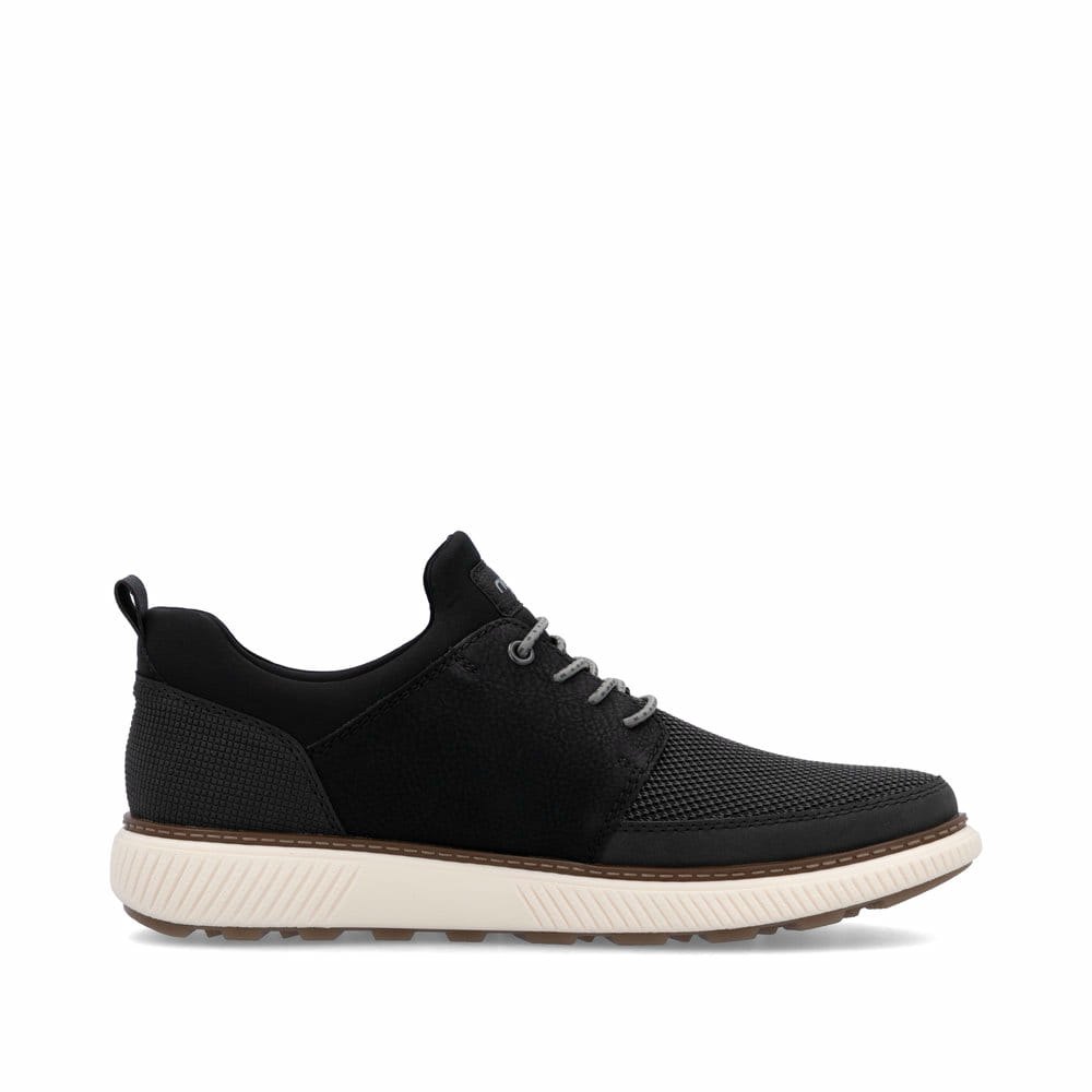Schwarze Rieker Herren Slipper B3354-00 mit einem Gummizug sowie Extraweite H. Schuh Innenseite.