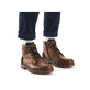 Fuchsbraune Rieker Herren Schnürstiefel 39820-22 mit griffiger Fiber-Grip Sohle. Schuh am Fuß.