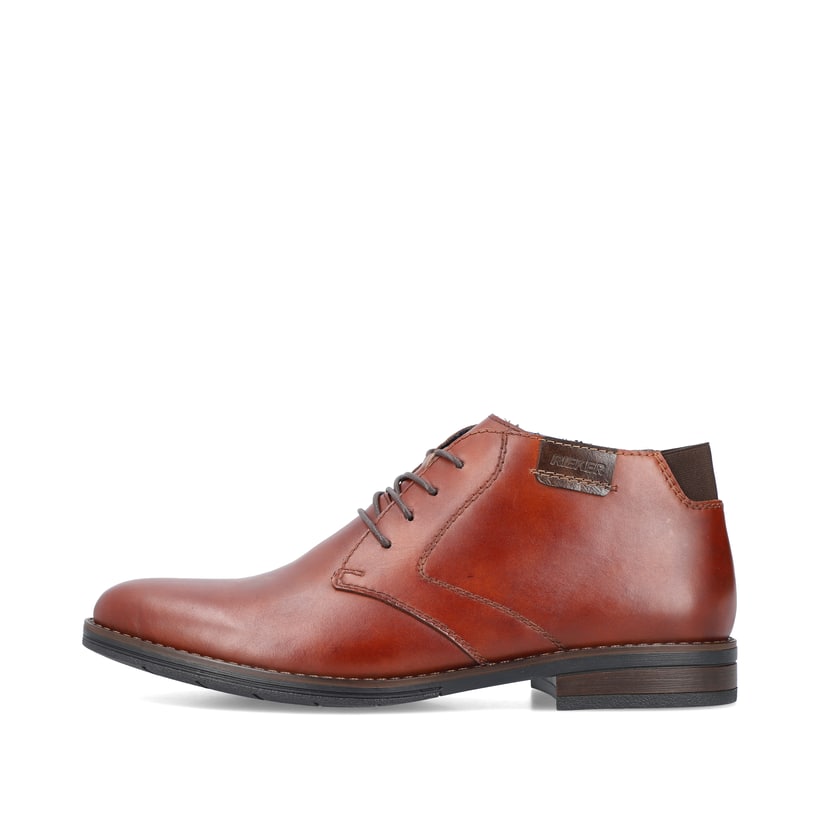
Fuchsbraune Rieker Herren Schnürschuhe 10301-24 mit Schnürung sowie einer Profilsohle. Schuh Außenseite