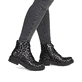 Gold-schwarze Rieker Damen Biker Boots 78240-90 mit einem Reißverschluss. Schuh am Fuß.