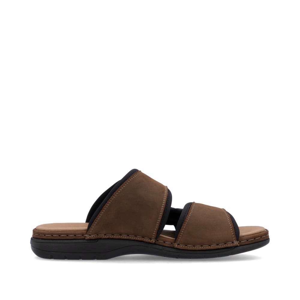 Mules Rieker marron homme 25559-25 en cuir velours avec fermeture velcro. Côté intérieur de la chaussure.