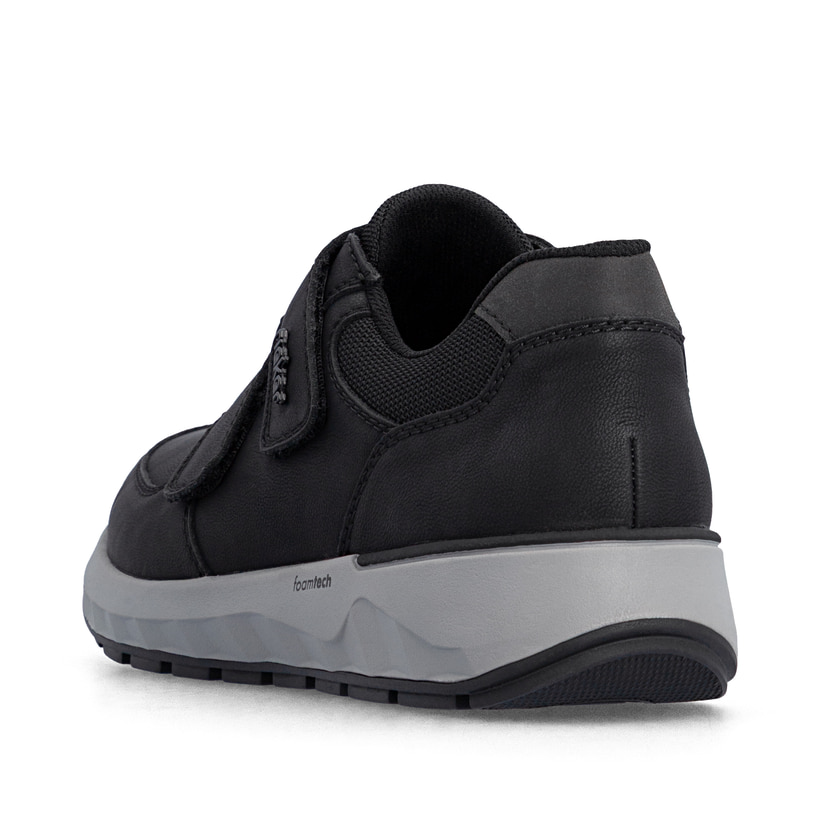 Schwarze Rieker Herren Slipper 11552-00 aus Glattleder mit einem Klettverschluss. Schuh von hinten.
