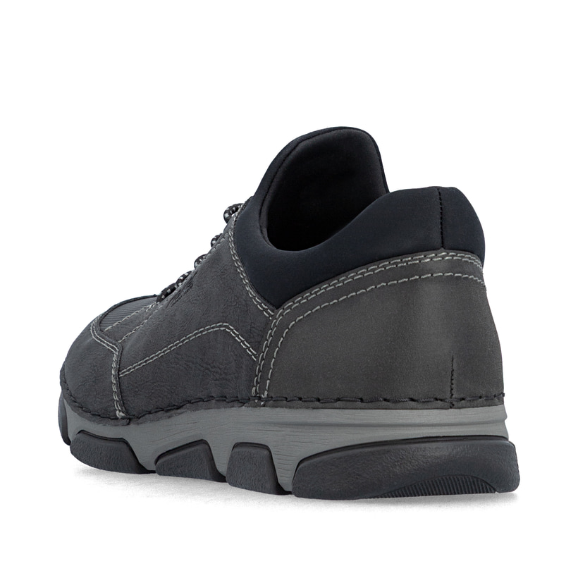 Schwarze Rieker Herren Slipper 15950-00 mit einem Gummizug sowie Extraweite H. Schuh von hinten.